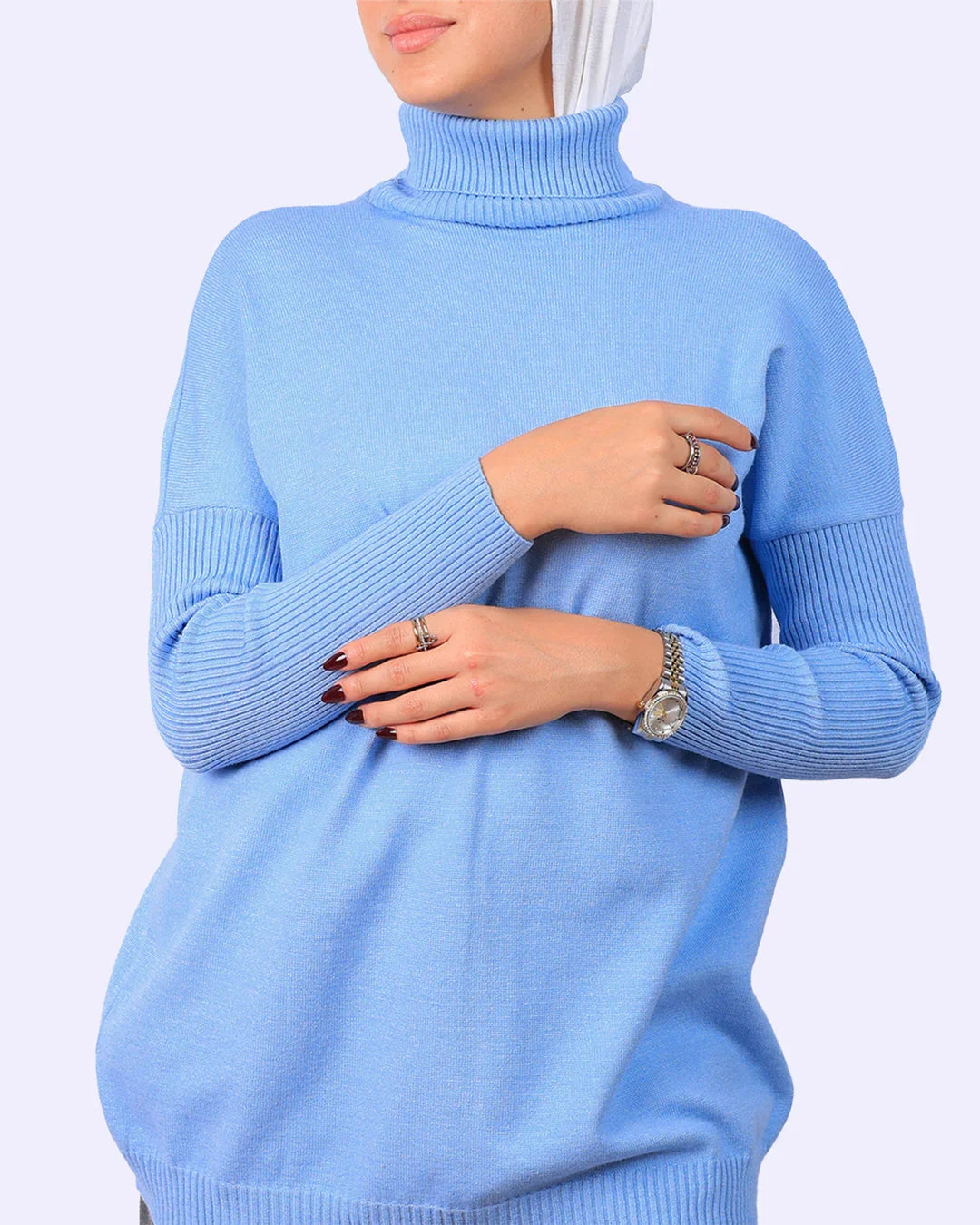 Woman in light blue turtleneck sweater from WIND Shopping, Egypt fashion store