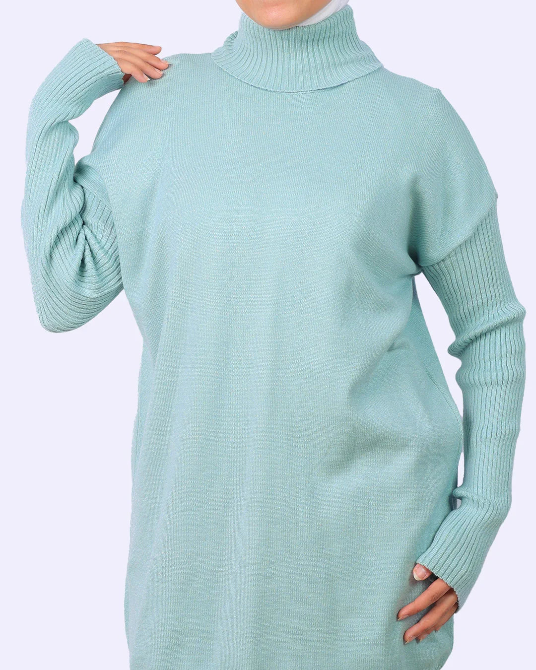 Woman wearing light blue ribbed turtleneck sweater dress from WIND Shopping