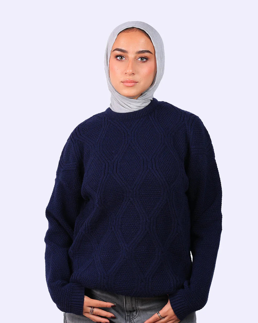 Woman in a grey hijab and navy blue textured sweater, WIND Shopping fashion in Egypt