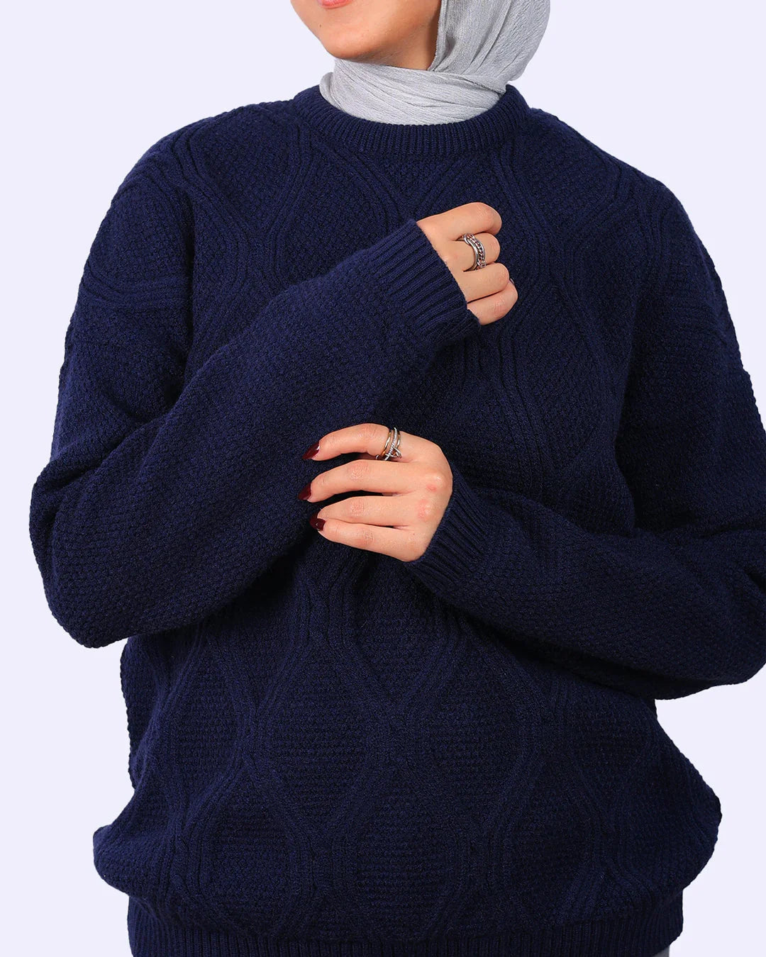 Woman wearing a navy blue textured sweater and light grey hijab from WIND Shopping Egypt