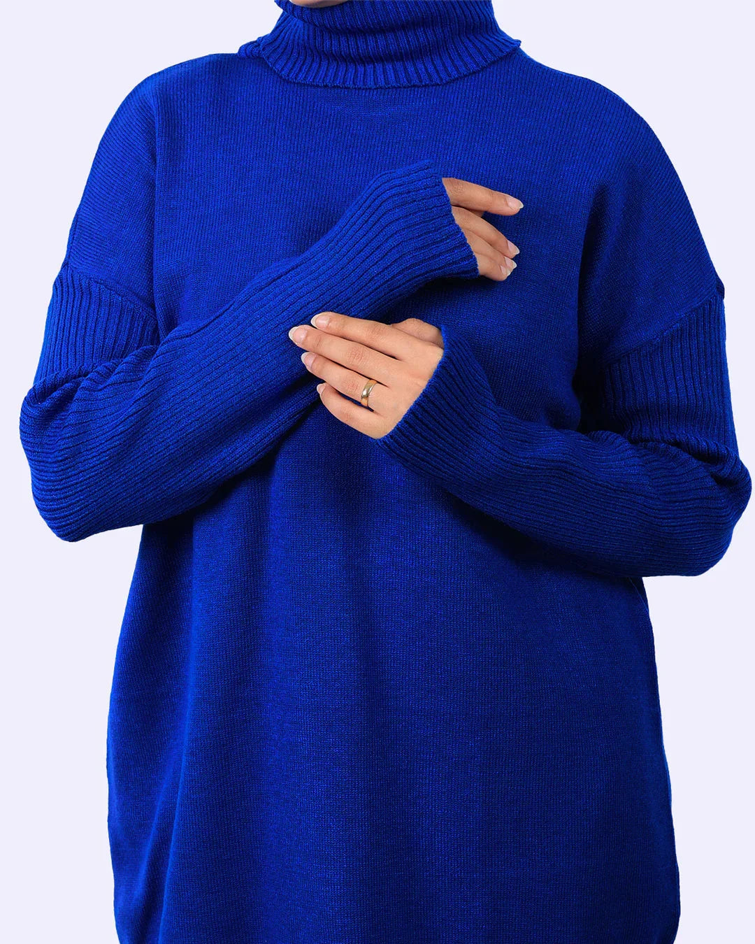 Woman wearing royal blue turtleneck sweater, WIND Shopping Egypt fashion collection