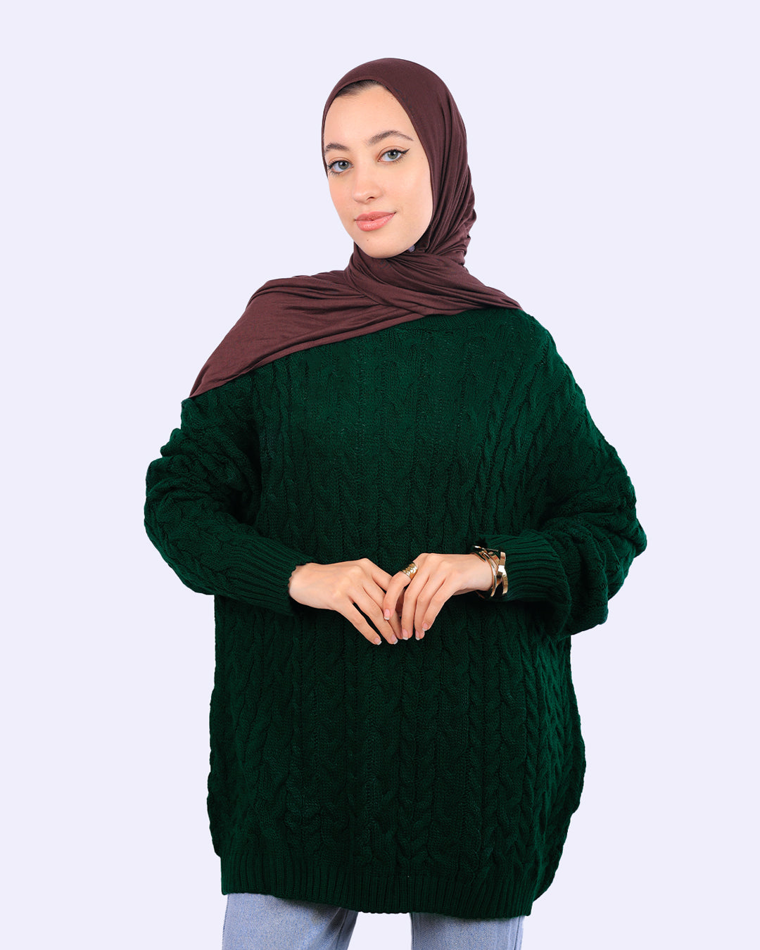 Woman in dark green cable knit sweater and brown hijab, WIND Shopping Egypt fashion