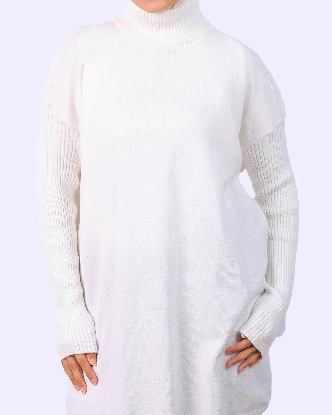 Woman wearing a white ribbed turtleneck sweater dress from WIND Shopping