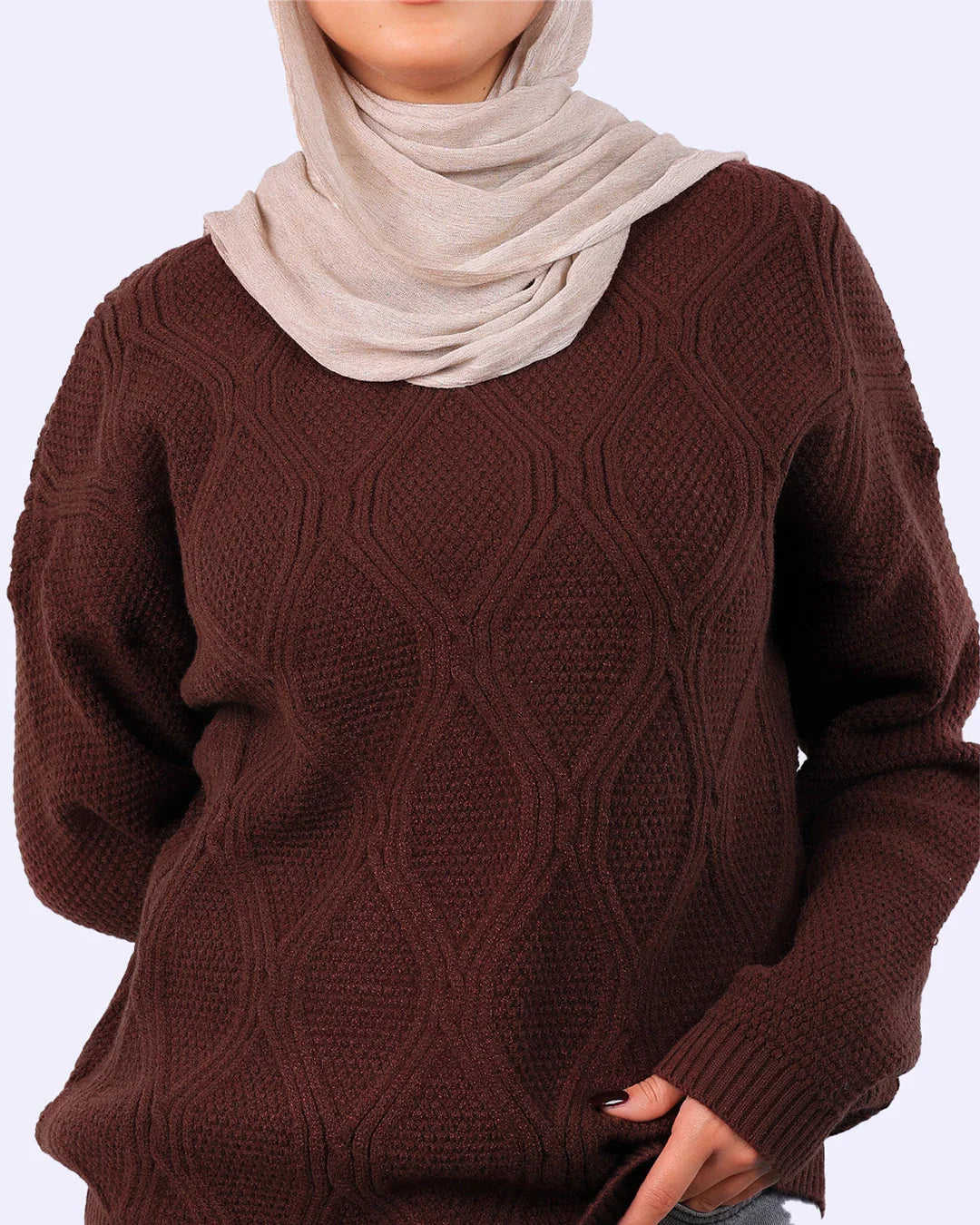 Woman wearing a brown textured knit sweater and beige hijab, stylish winter fashion Egypt