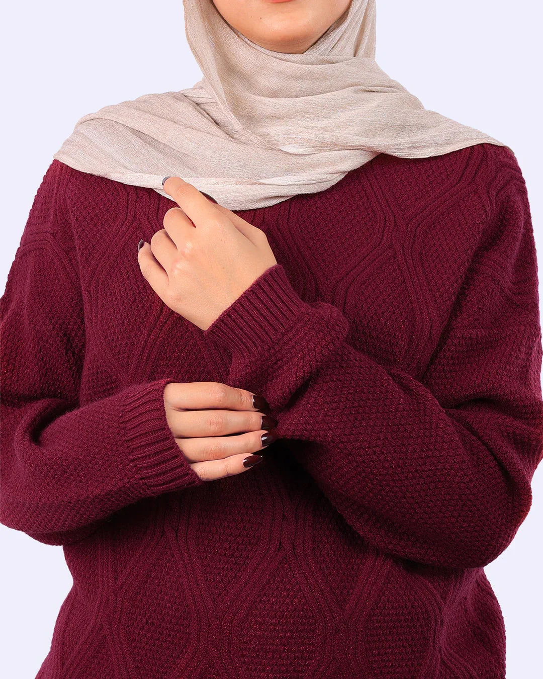 Woman wearing a textured maroon sweater and beige hijab, WIND Shopping Egypt fashion