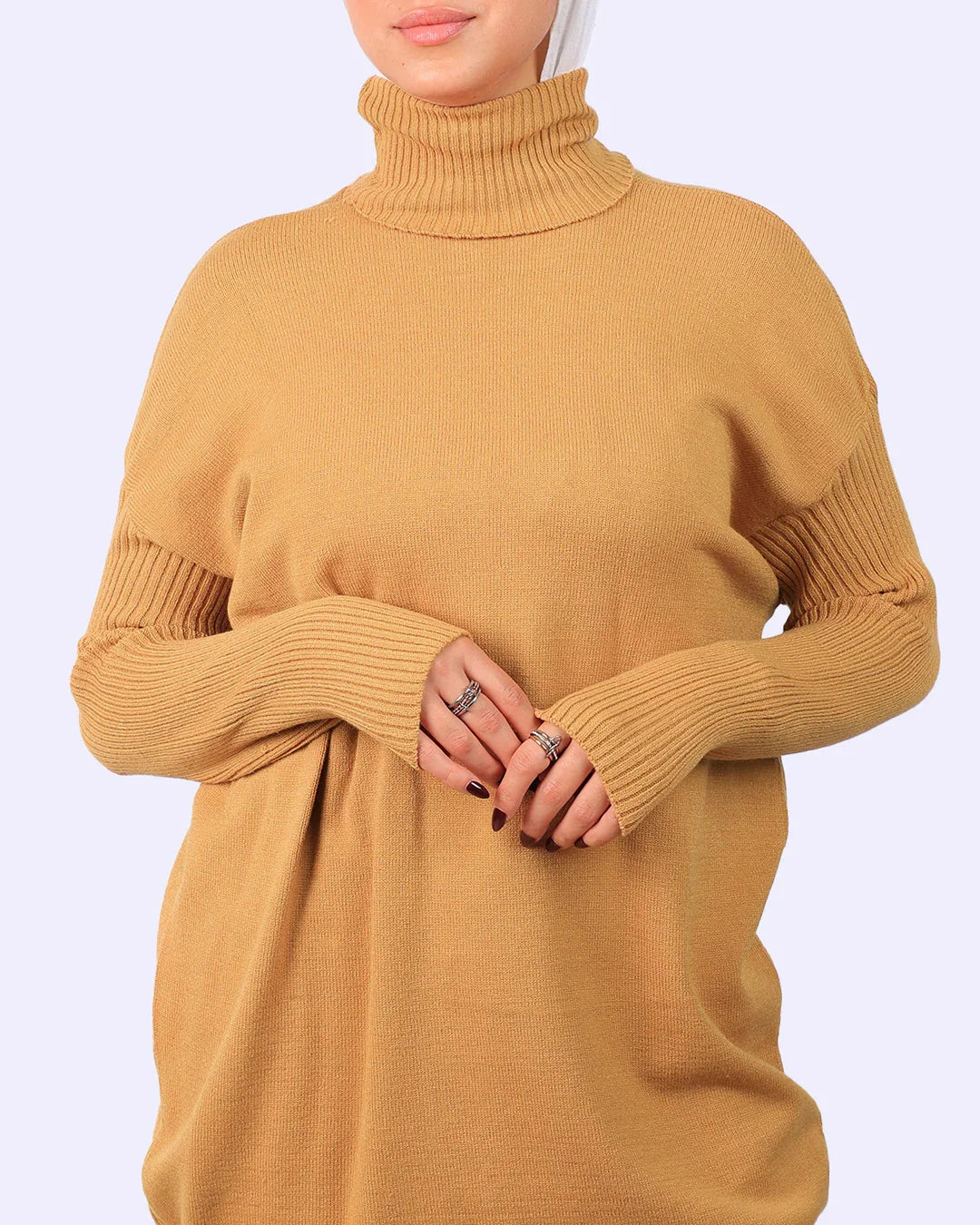 Woman wearing camel knit turtleneck sweater from WIND Shopping Egypt fashion collection