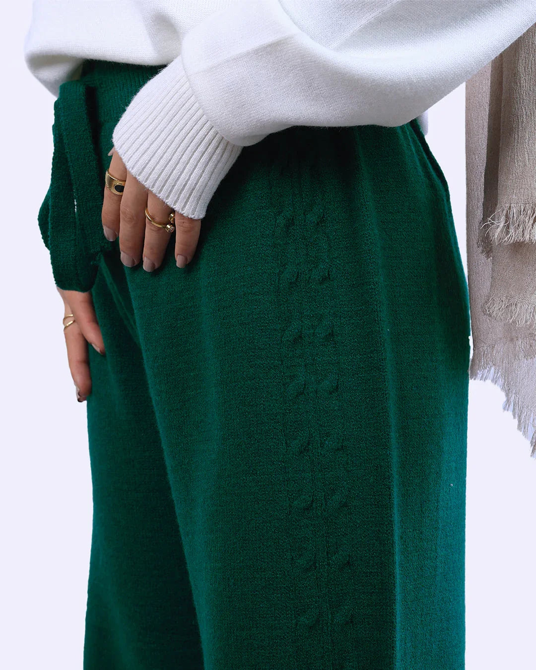 Close-up of green textured knit pants and white sweater, WIND Shopping fashion Egypt