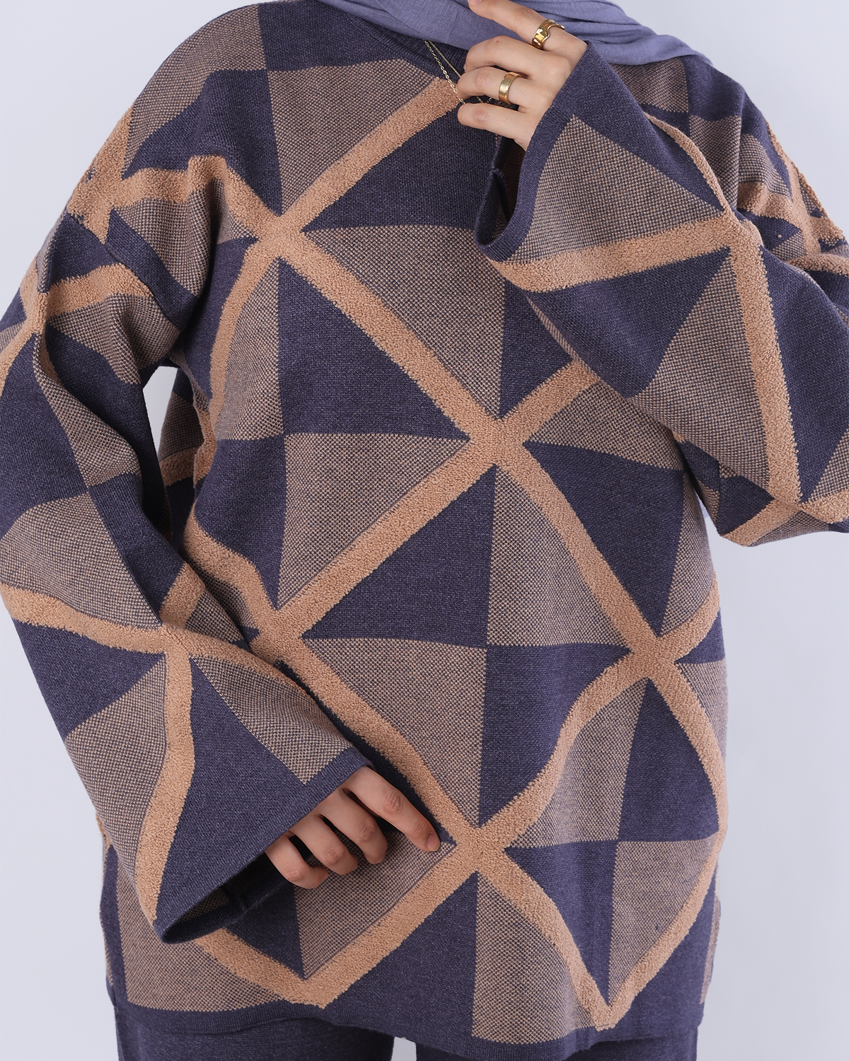 Geometric patterned scarf with triangles in brown and blue on a white background