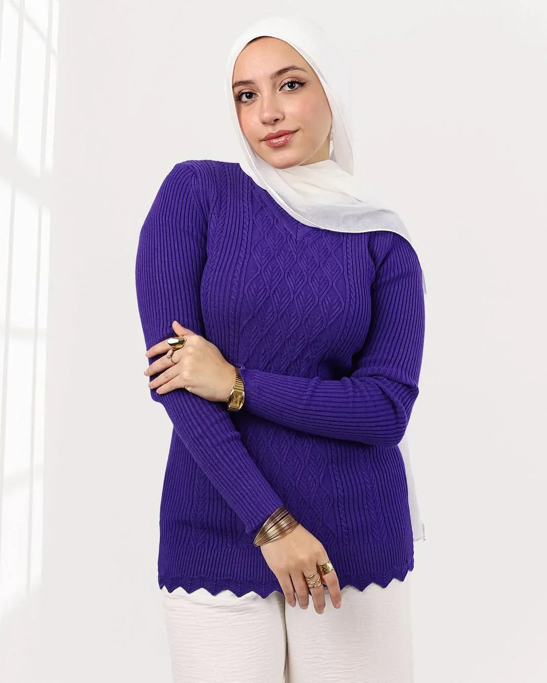Woman in white hijab and purple knit sweater posing indoors, modern Egyptian fashion, WIND Shopping