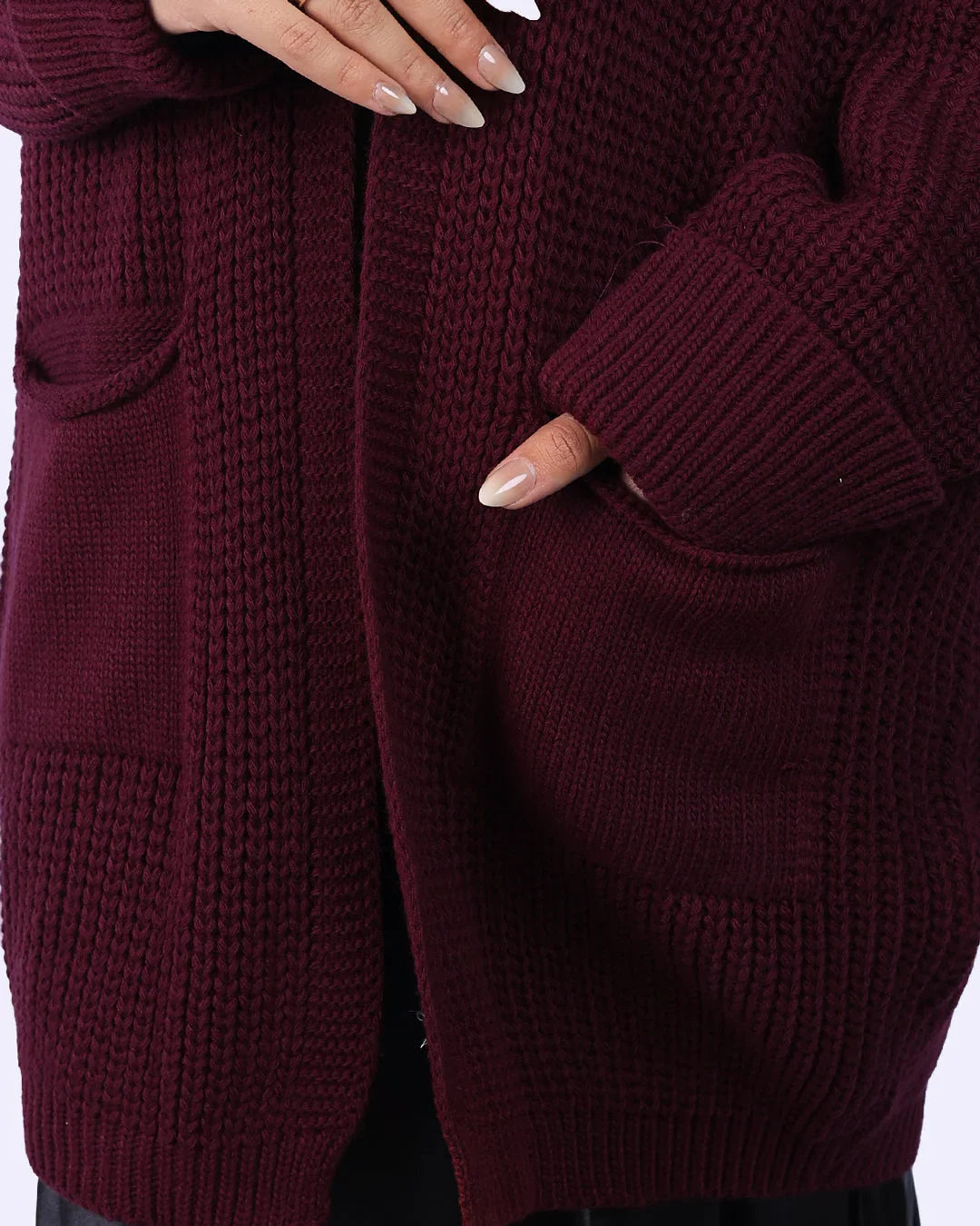 Close-up of burgundy knit cardigan with pockets, premium women’s fashion from WIND Shopping Egypt