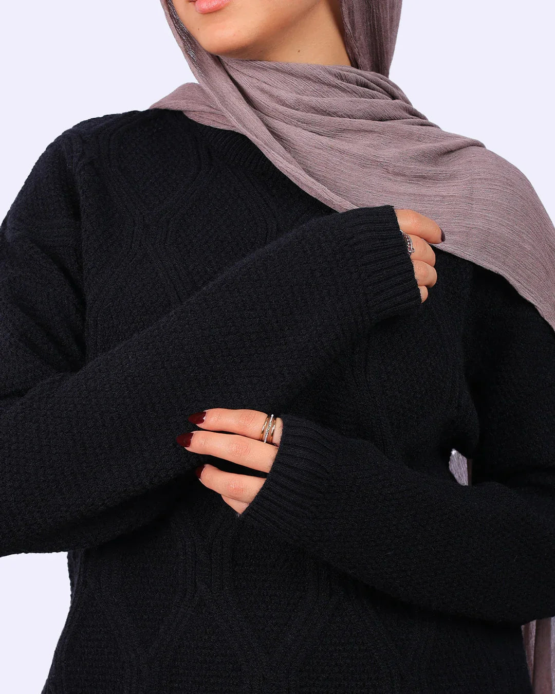 Woman in black textured sweater and mauve hijab, stylish modest fashion from WIND Shopping